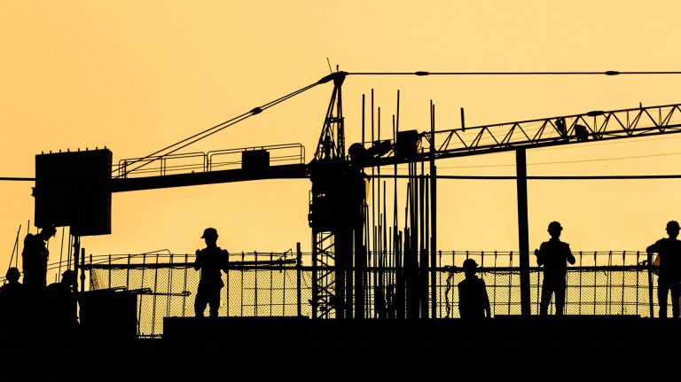 Silhouetted Construction Workers